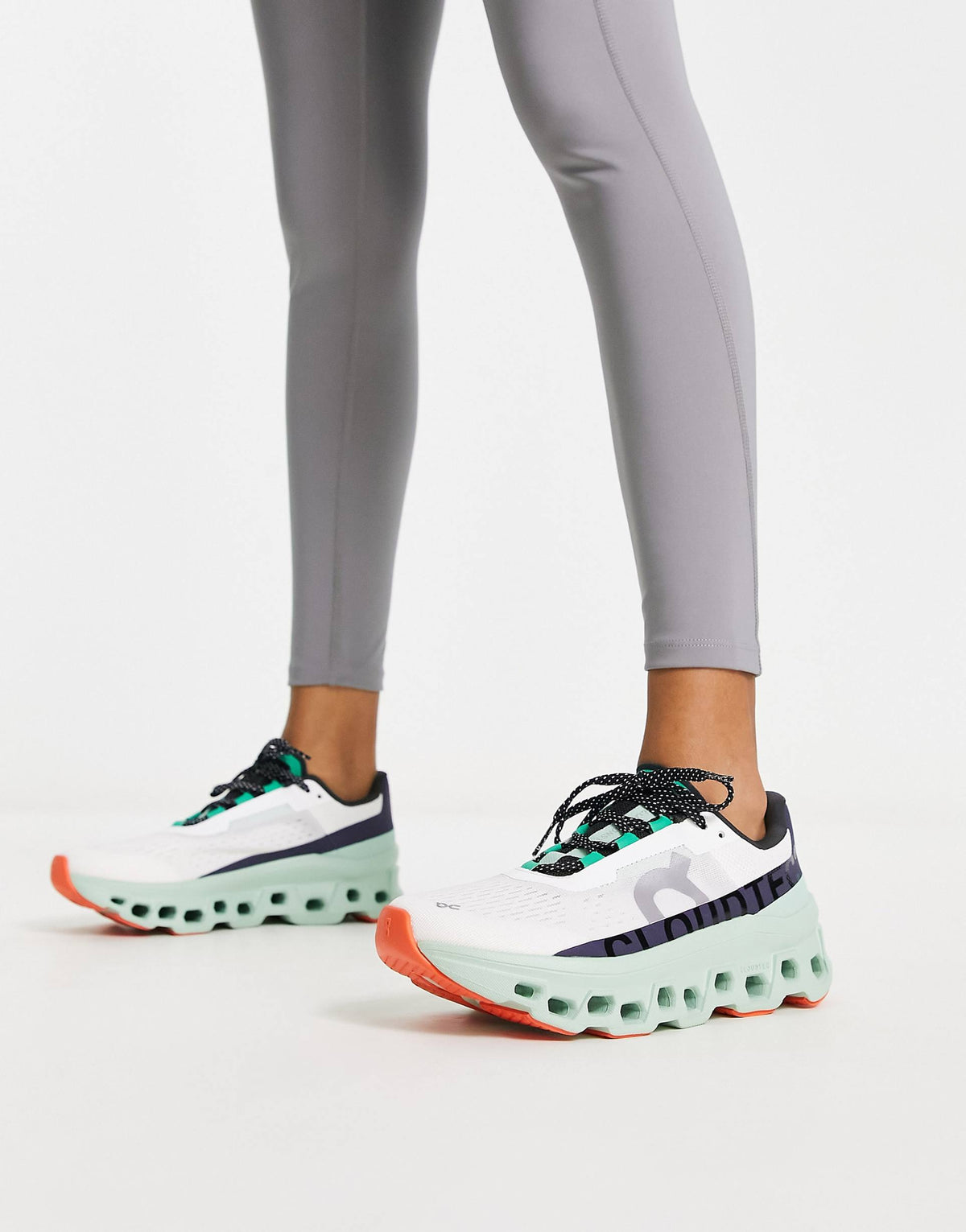 ON Cloudmonster trainers in white and green