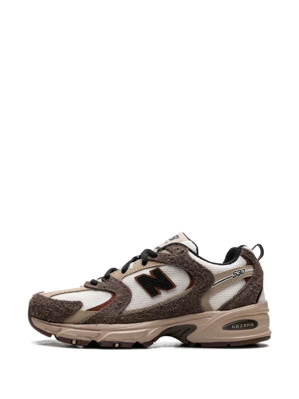 New Balance 530 trainers in white and brown