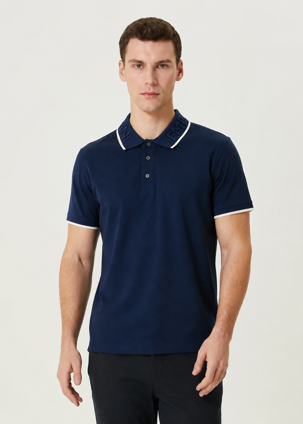 Emporio Armani polo shirt features a distinct embroidered logo on the collar