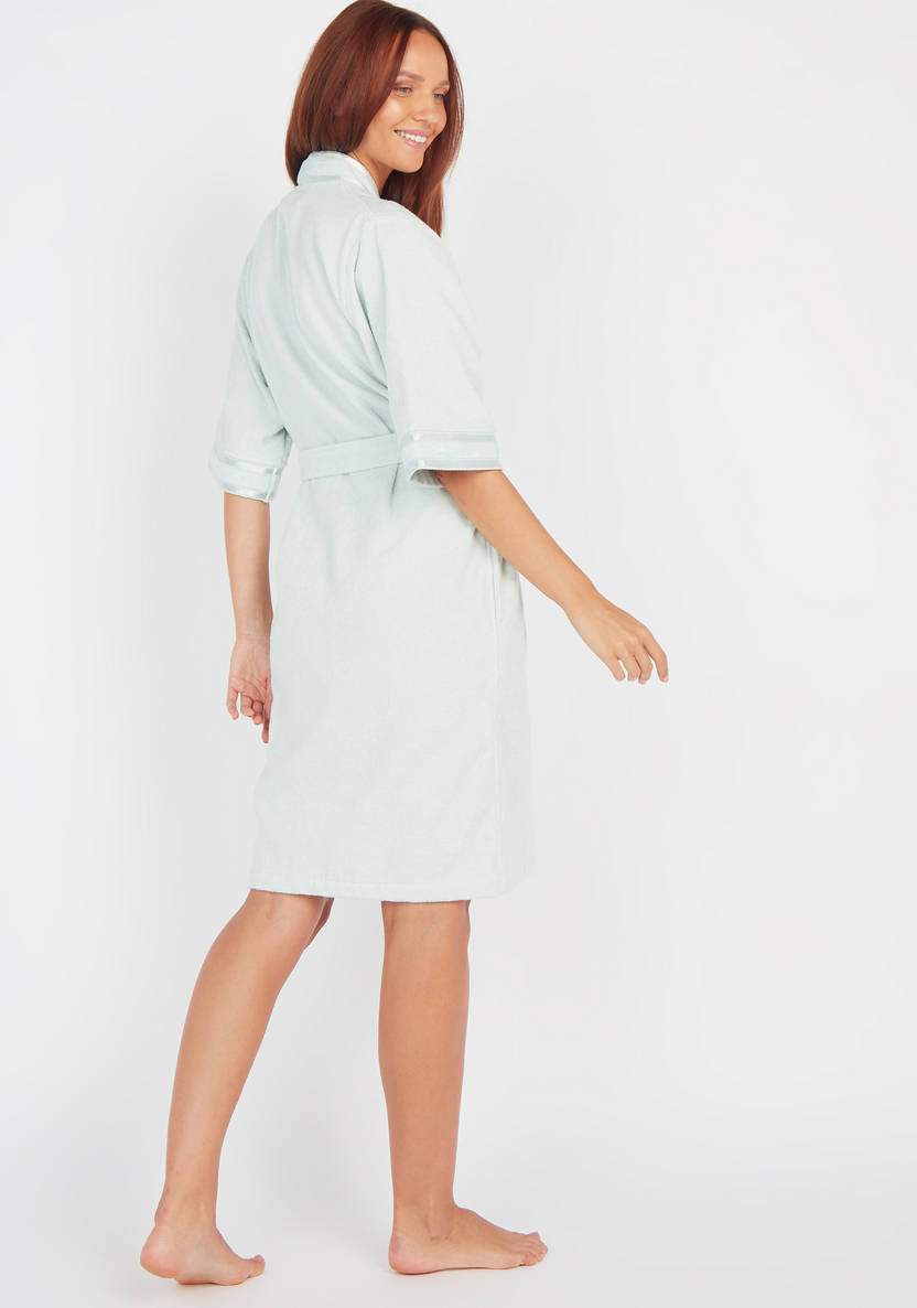 Textured swimsuit with 3/4 sleeves and tie details