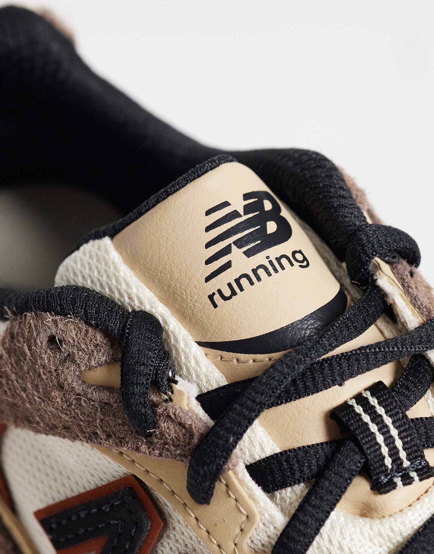 New Balance 530 trainers in white and brown