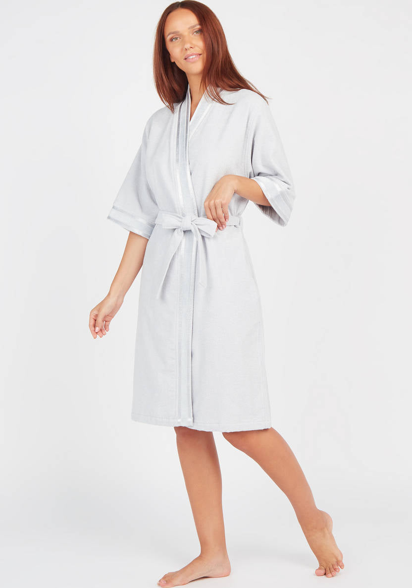 Textured swimsuit with 3/4 sleeves and tie details