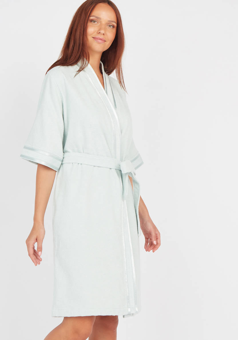 Textured swimsuit with 3/4 sleeves and tie details