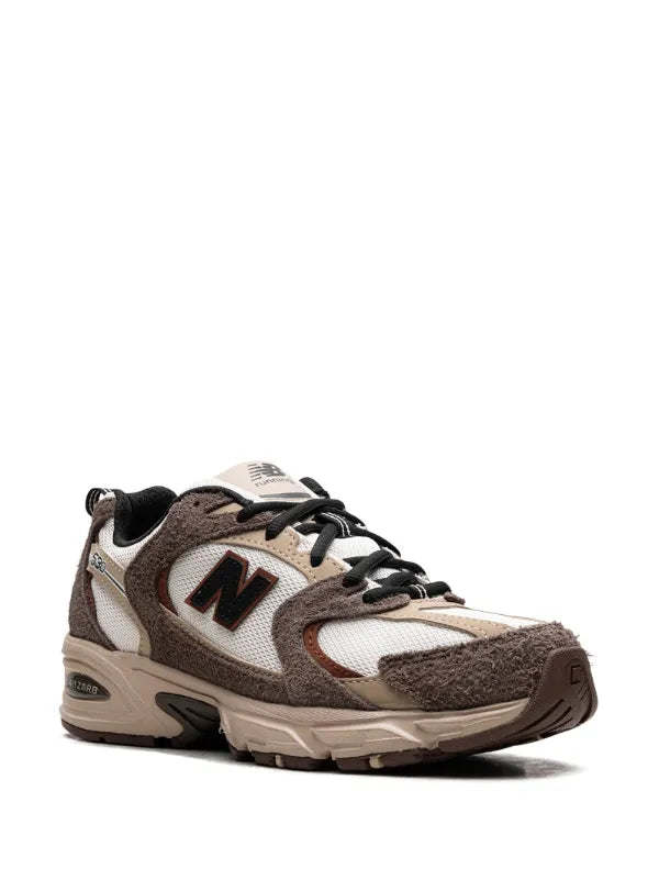 New Balance 530 trainers in white and brown