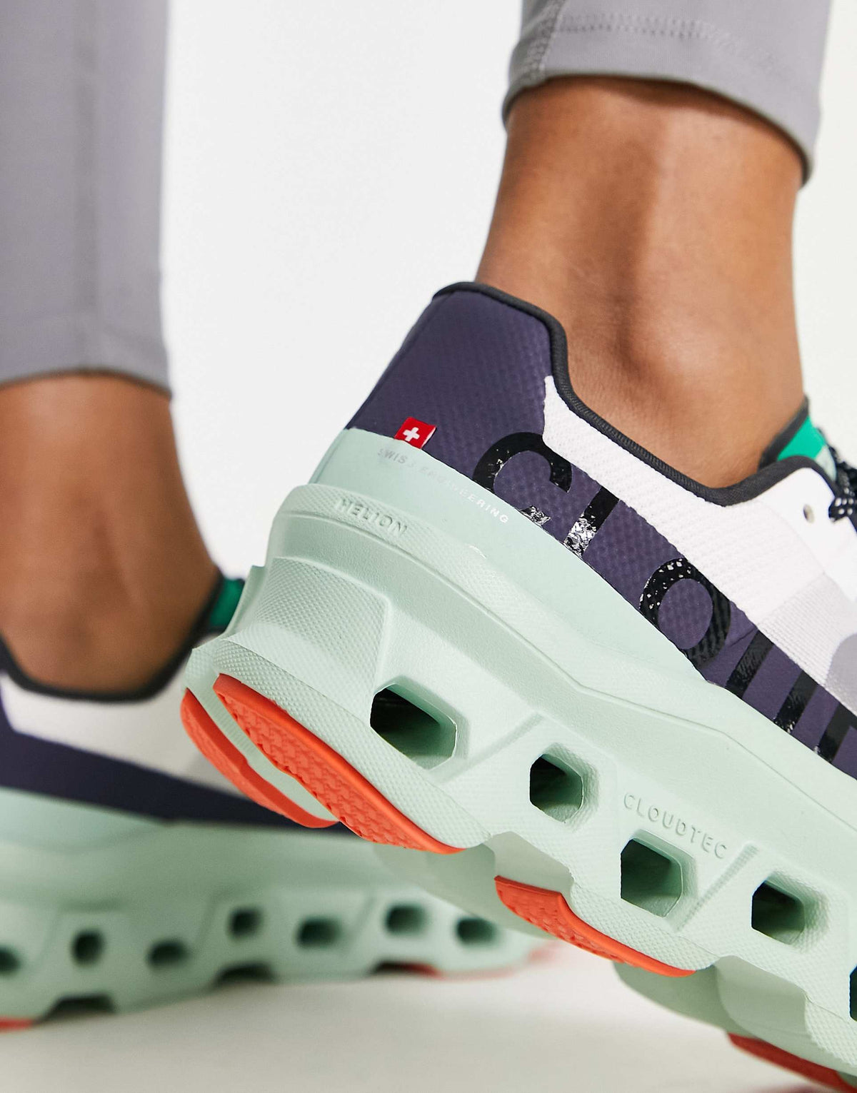 ON Cloudmonster trainers in white and green