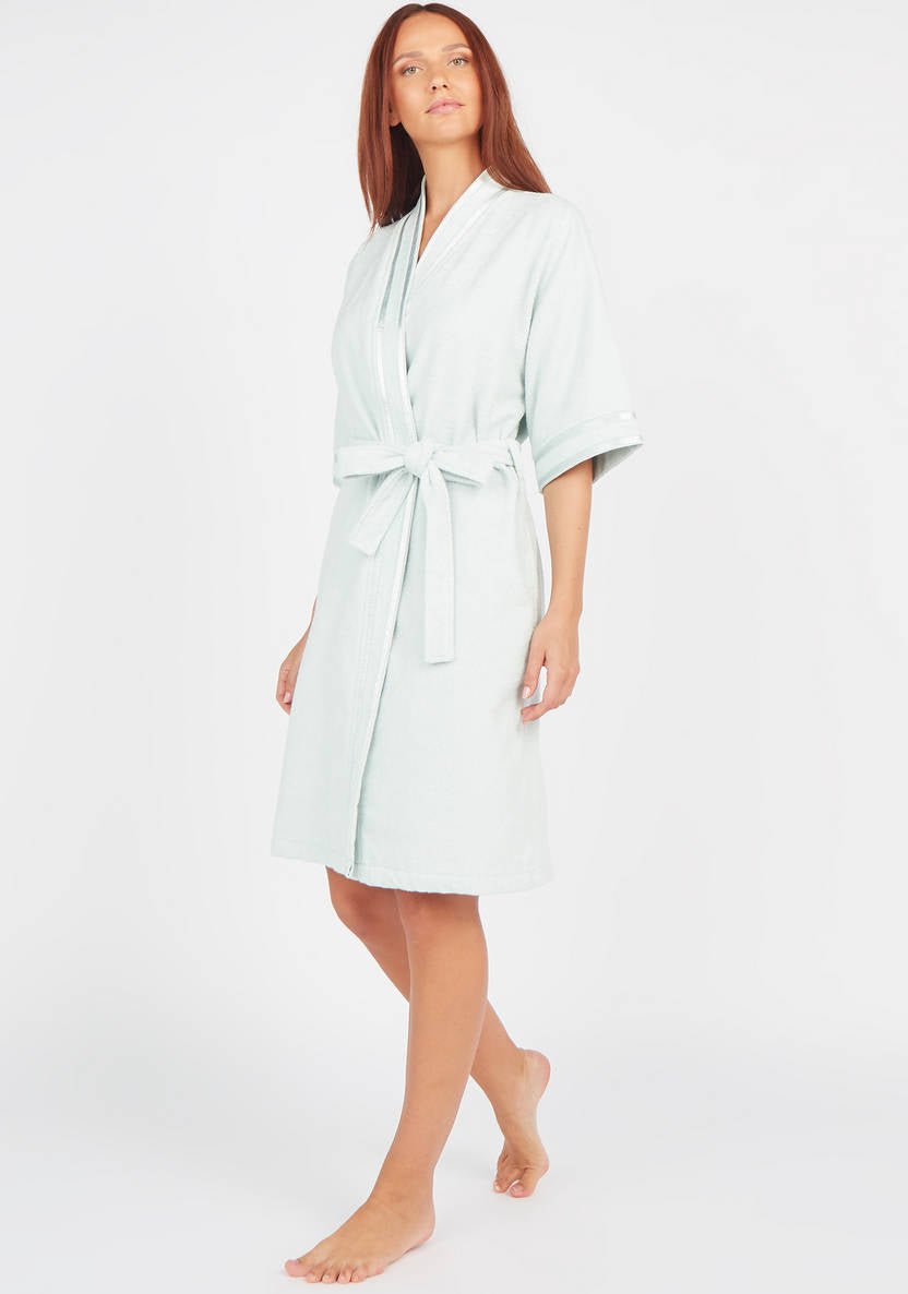 Textured swimsuit with 3/4 sleeves and tie details