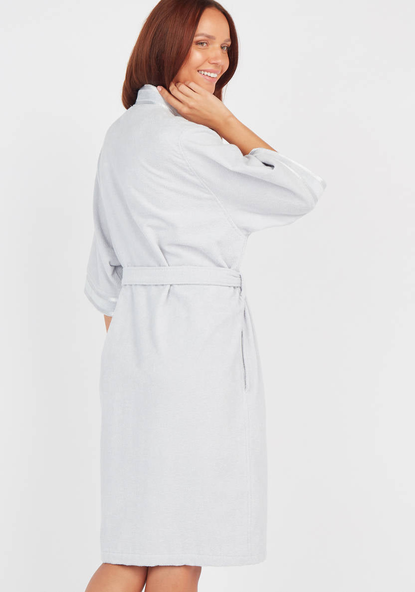 Textured swimsuit with 3/4 sleeves and tie details