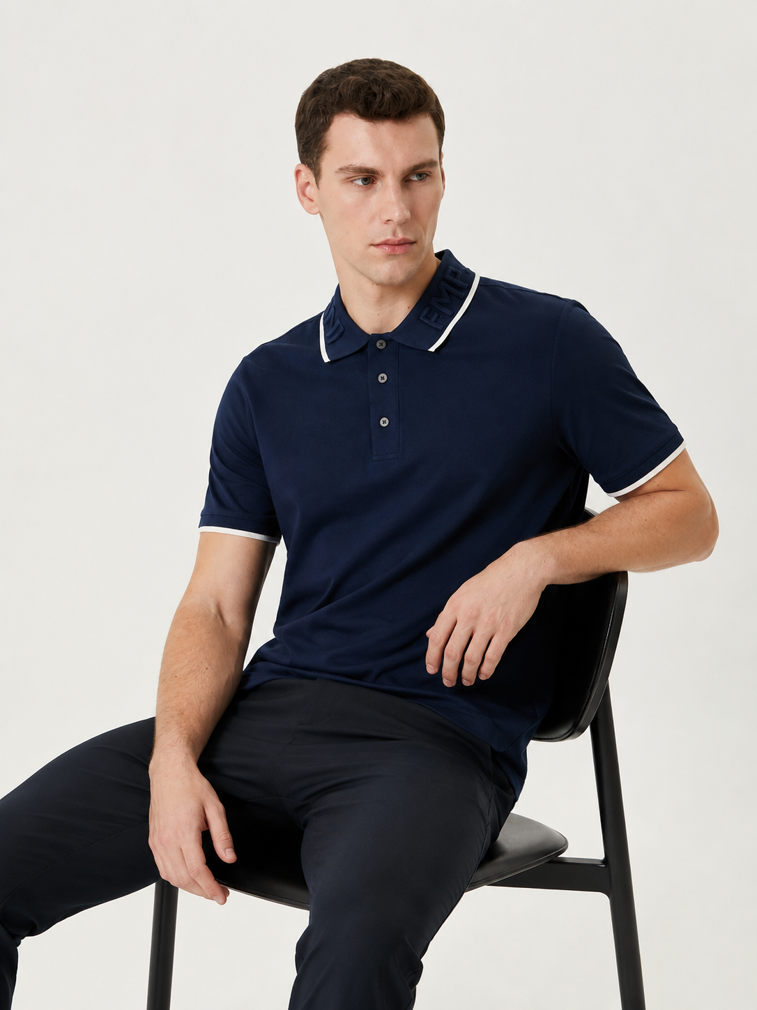 Emporio Armani polo shirt features a distinct embroidered logo on the collar