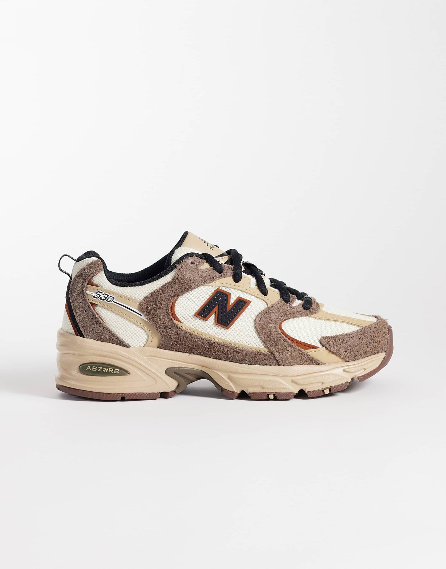 New Balance 530 trainers in white and brown